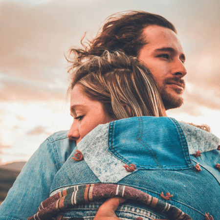 a girl and boy hugging. Feminine in a Relationship